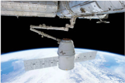 A picture of a spacecraft and Earth from space